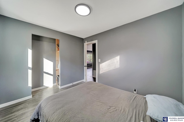 bedroom with hardwood / wood-style floors