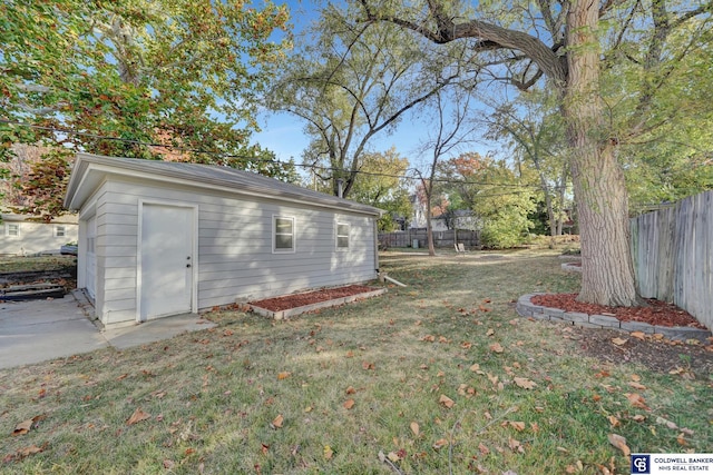 view of outbuilding featuring a yard