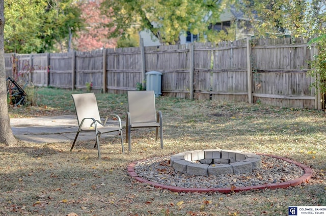 view of yard with an outdoor fire pit