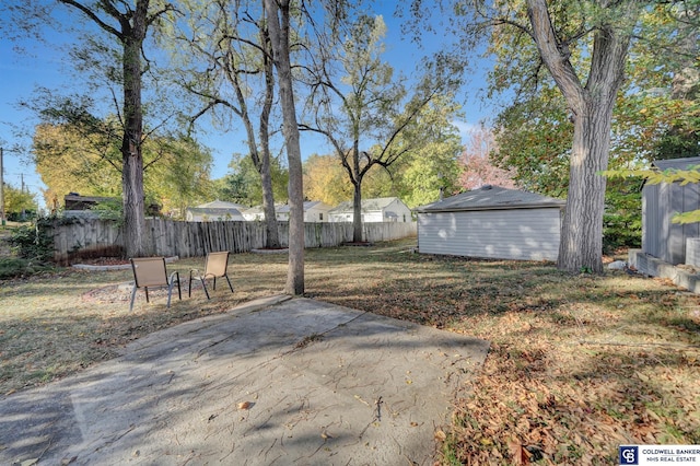 view of yard with a patio and an outdoor structure