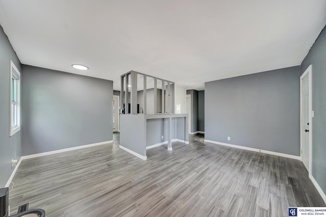 unfurnished living room with light hardwood / wood-style flooring