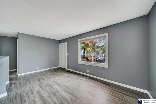 spare room with light wood-type flooring