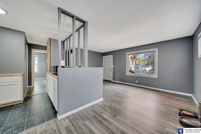 kitchen featuring white cabinets and dark hardwood / wood-style flooring