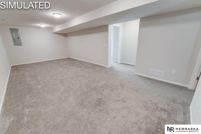 basement with carpet flooring and electric panel