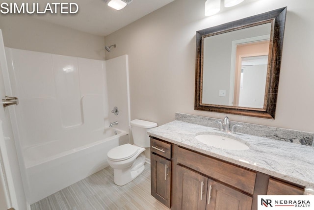 full bathroom with bathing tub / shower combination, vanity, and toilet