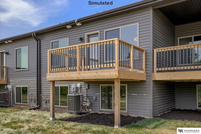 back of house with central AC unit and a balcony