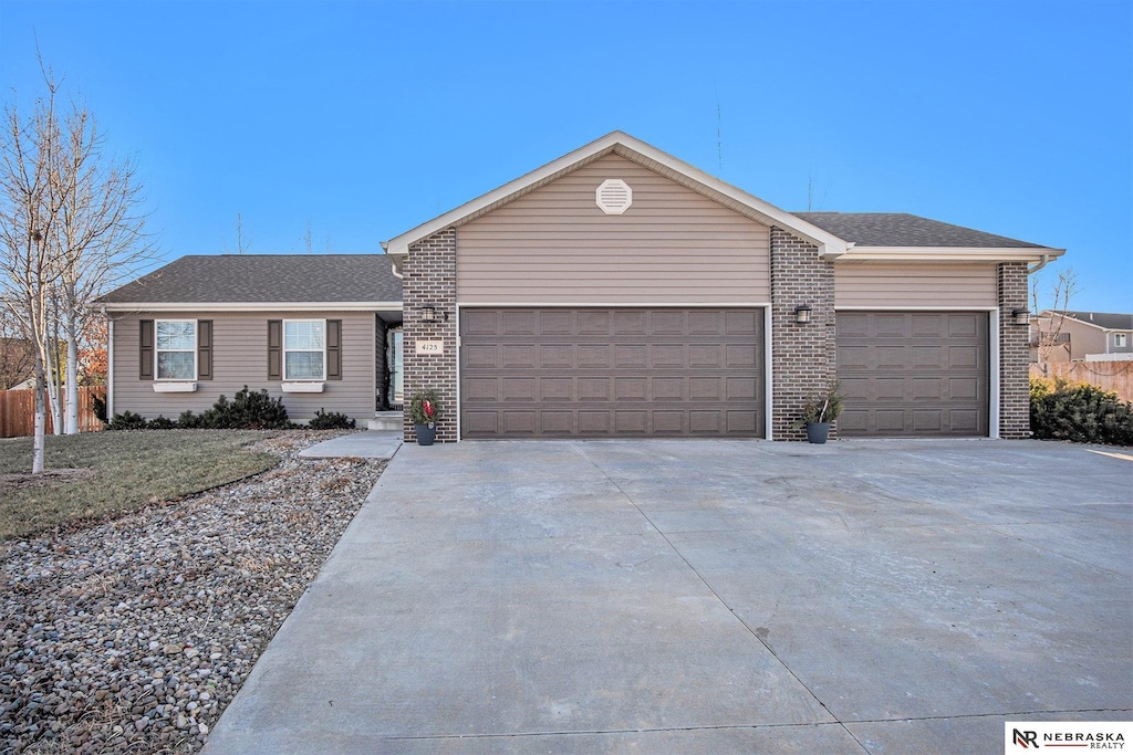 single story home with a garage