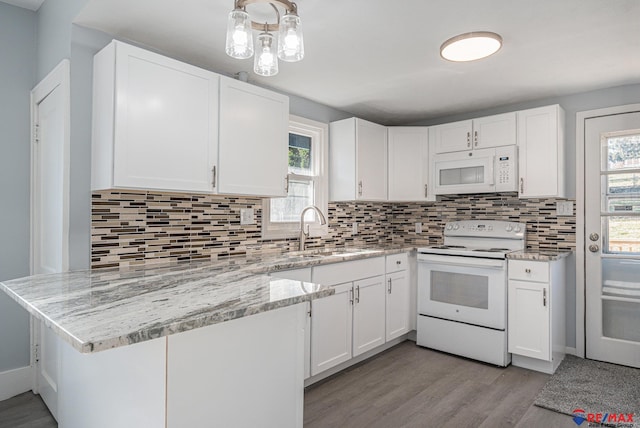 kitchen with white cabinetry, light wood-type flooring, white appliances, and sink