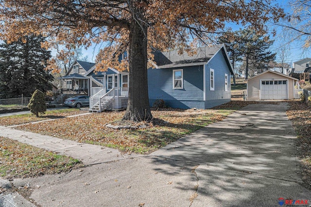 view of front of house with a porch, an outdoor structure, and a garage