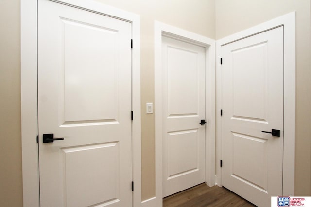 corridor featuring dark hardwood / wood-style floors