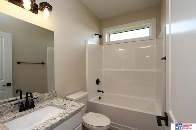 full bathroom with vanity, bathtub / shower combination, and toilet