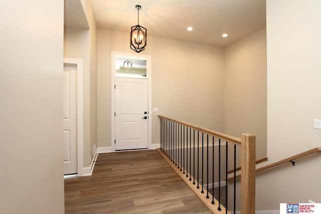 entrance foyer featuring hardwood / wood-style flooring and an inviting chandelier