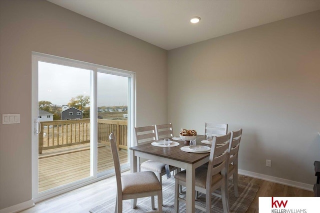 dining space featuring hardwood / wood-style flooring