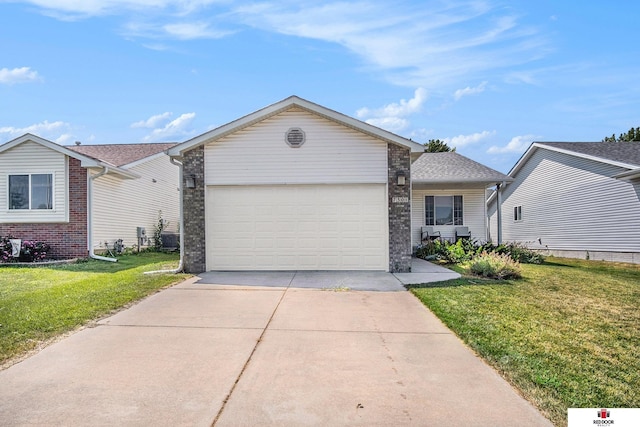 ranch-style home featuring a front yard and a garage