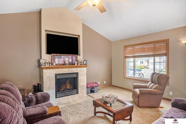 carpeted living room featuring ceiling fan, lofted ceiling, and a fireplace