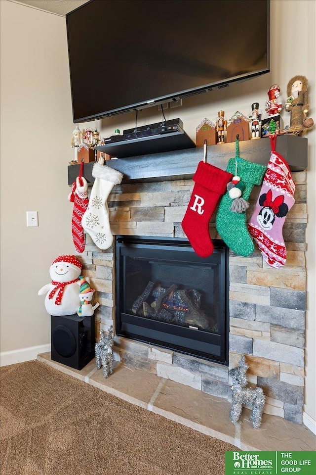 room details with carpet floors and a fireplace