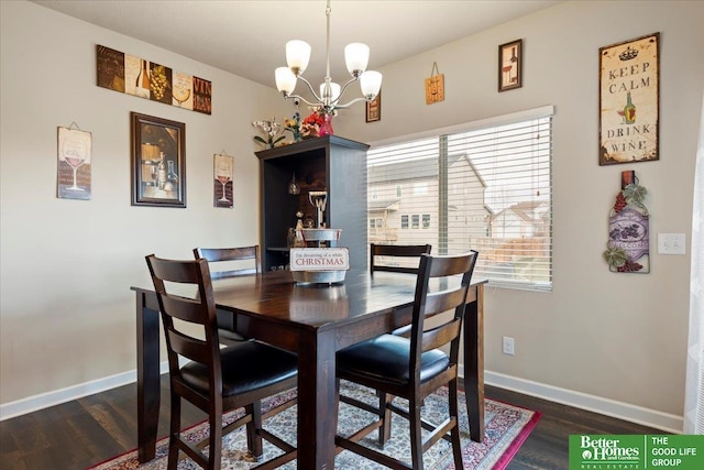 dining room featuring a chandelier and dark hardwood / wood-style flooring