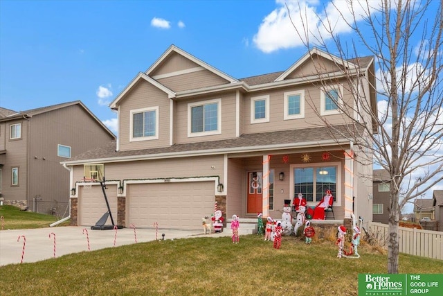 view of front of home featuring a front lawn, covered porch, and a garage