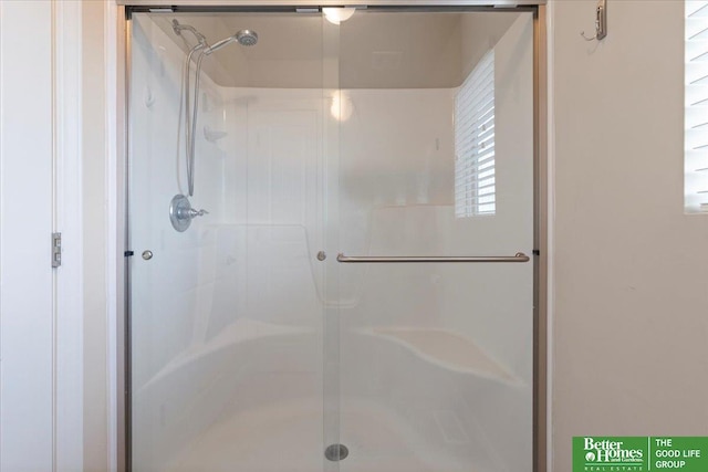 bathroom featuring walk in shower and a wealth of natural light