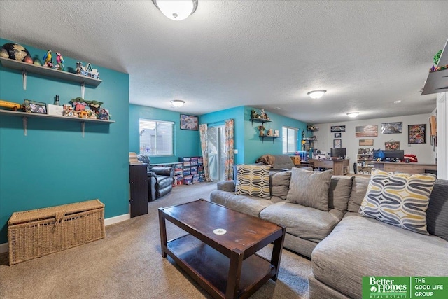 living room featuring carpet flooring, plenty of natural light, and a textured ceiling