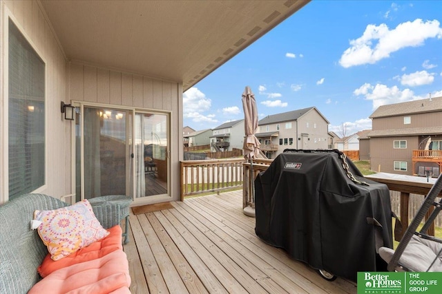 wooden terrace featuring grilling area