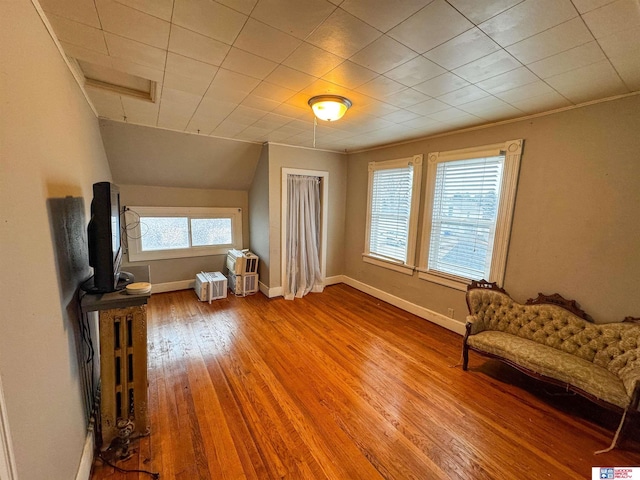 unfurnished room featuring hardwood / wood-style floors and ornamental molding