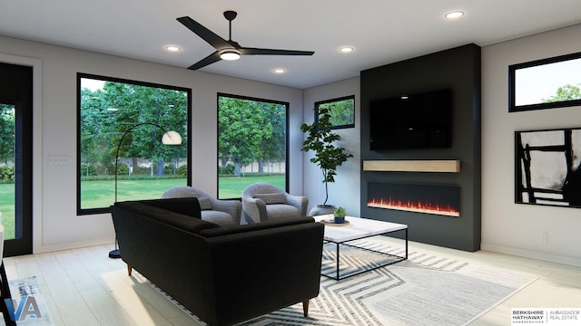 living room featuring ceiling fan, a fireplace, and light hardwood / wood-style flooring