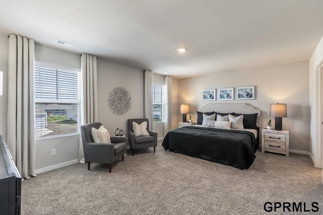 bedroom with light carpet