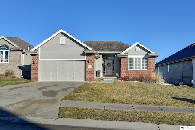 view of front of house with a garage and a front lawn