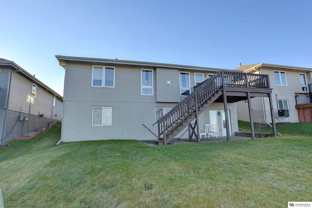 rear view of house with a lawn, cooling unit, and a deck