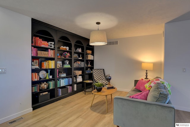 sitting room featuring light hardwood / wood-style floors