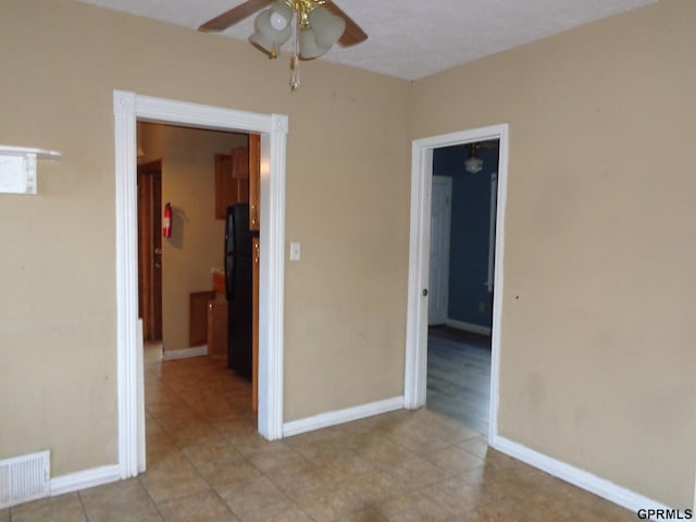 unfurnished room with ceiling fan