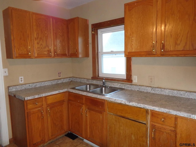 kitchen with sink and light tile patterned floors