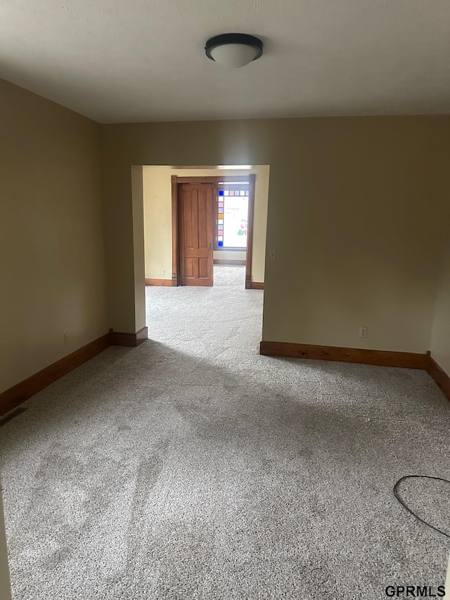 spare room with carpet flooring