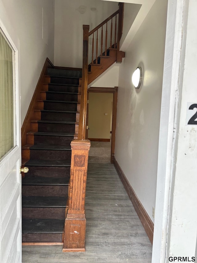 stairway featuring hardwood / wood-style floors