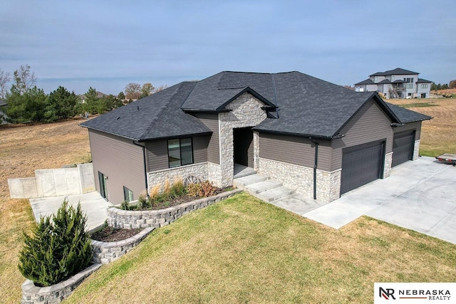 view of front of property with a front lawn and a garage