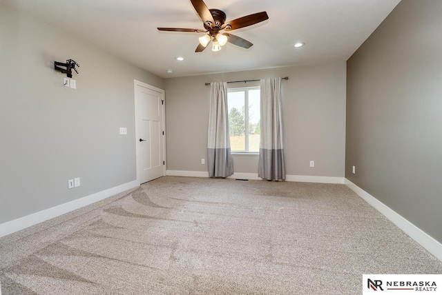 carpeted empty room with ceiling fan