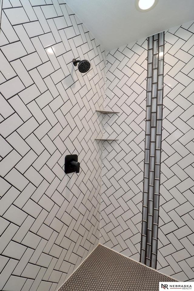 details with a tile shower