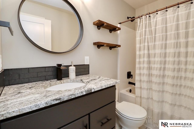 full bathroom with shower / bath combo, toilet, and vanity