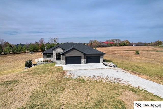 view of front of home featuring a garage and a front lawn