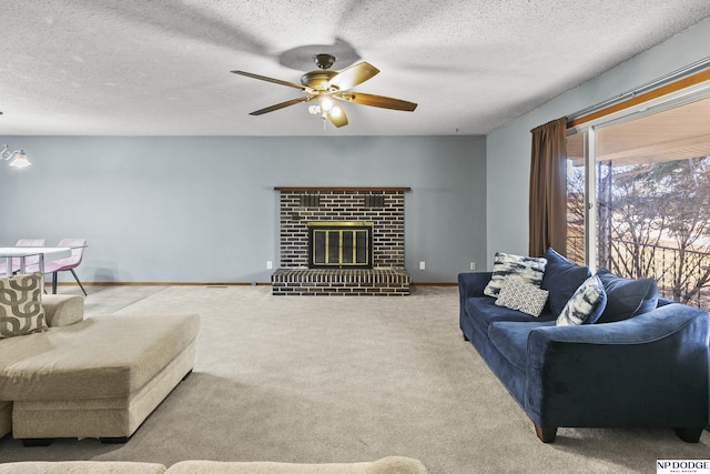 living room with ceiling fan, a fireplace, light carpet, and a textured ceiling