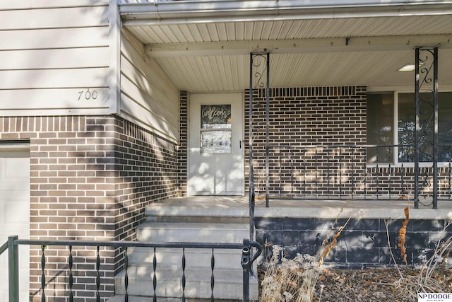 entrance to property with a porch