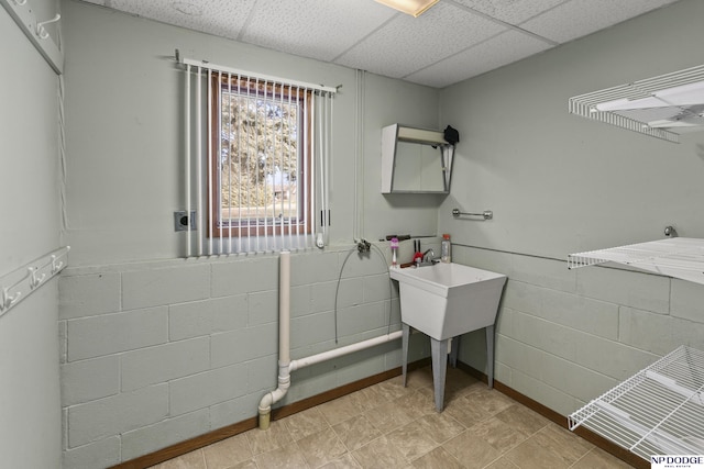 bathroom with a paneled ceiling