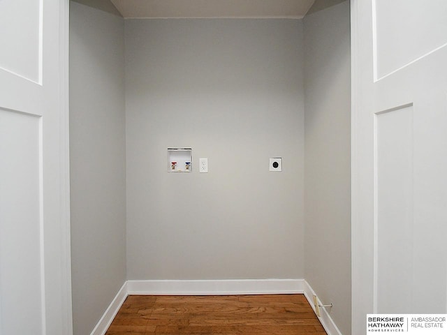 laundry area featuring hardwood / wood-style flooring, electric dryer hookup, and washer hookup