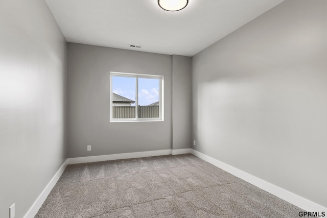 empty room featuring carpet floors