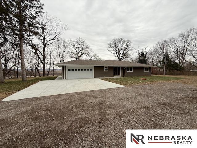 ranch-style home featuring a garage