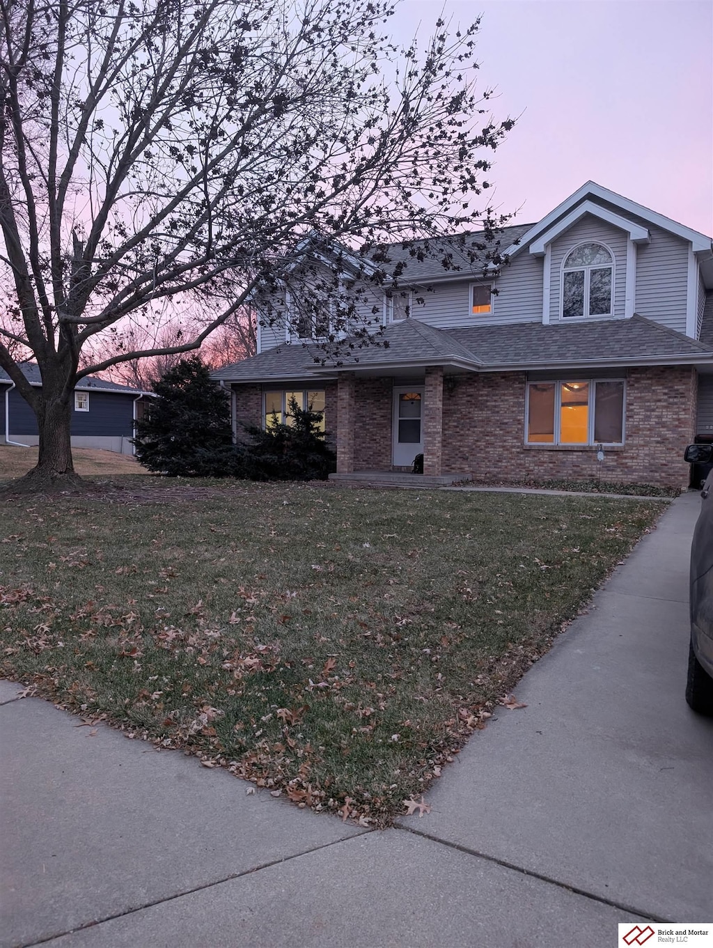 view of front of property with a lawn