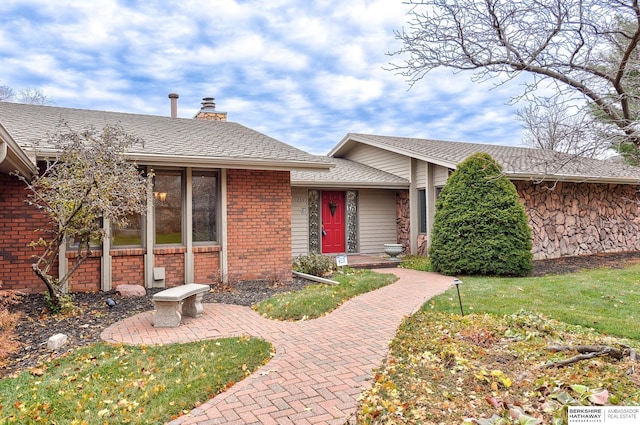 ranch-style house with a front yard