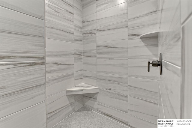 bathroom with tiled shower