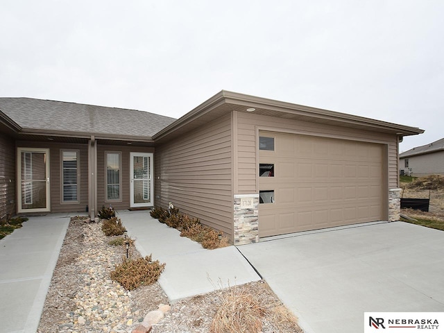 single story home featuring a garage